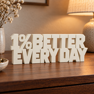 1% Better Every Day desk letters in a home setting