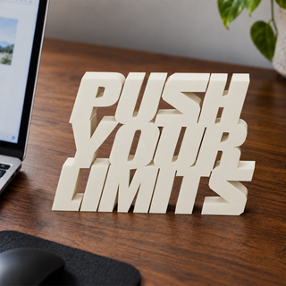 Push Your Limits desk letters on an office desk