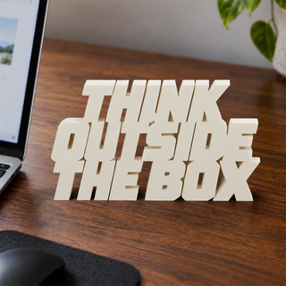 Think Outside the Box desk letters on an office desk