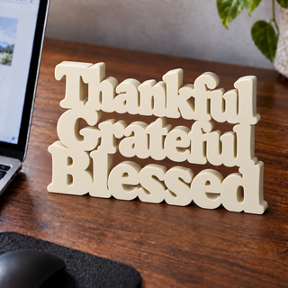 Thankful Grateful Blessed desk letters on an office desk