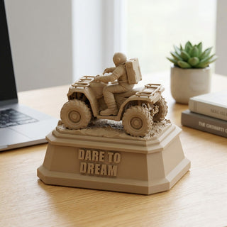Dare to Dream (Astronaut) desk trophy on a home office desk