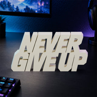 Never Give Up desk letters on a gaming desk