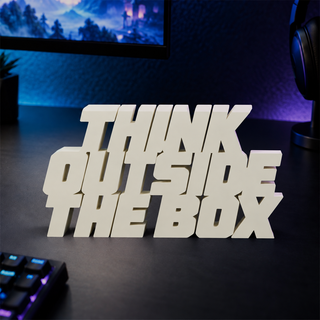 Think Outside the Box desk letters on a gaming desk