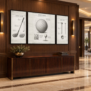 Vintage Golf Studies golf canvases above a walnut console in a marble hallway