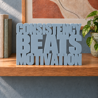 Consistency Beats Motivation desk letters in Light Gray