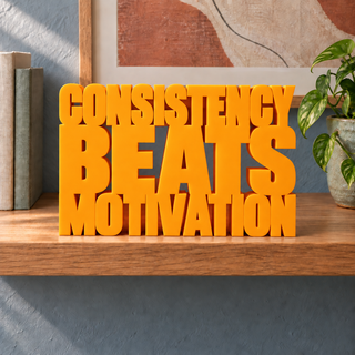 Consistency Beats Motivation desk letters in Orange