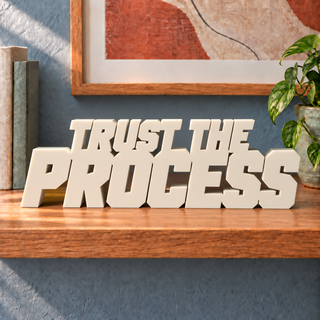 Trust the Process desk letters in Ivory on the ledge