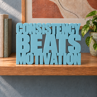 Consistency Beats Motivation desk letters in Teal Blue