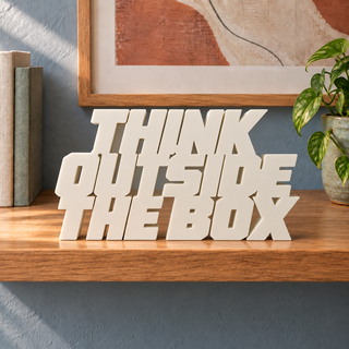 Think Outside the Box desk letters in Ivory on the ledge