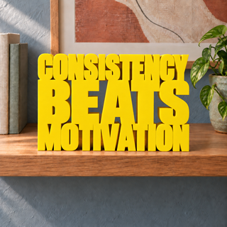 Consistency Beats Motivation desk letters in Yellow