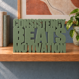 Consistency Beats Motivation desk letters in Army Green