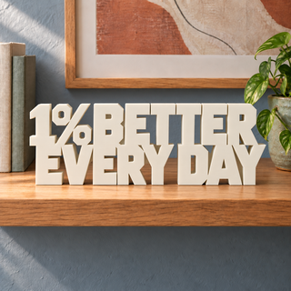 1% Better Every Day desk letters in Ivory on the ledge