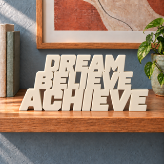 Dream Believe Achieve desk letters in Ivory on the ledge