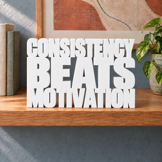 Consistency Beats Motivation desk letters in White