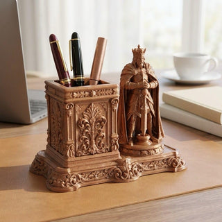 Royal King pen stand on an office desk beside a laptop and coffee cup
