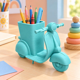 Turquoise retro scooter pencil holder on a kids desk filled with coloured pencils