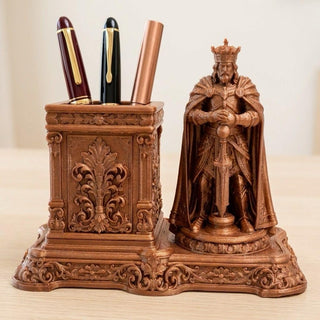 Royal King bronze pen stand with crowned king and sword beside a carved pen well