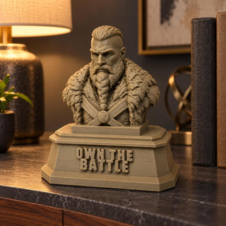 The Warrior sculpture styled on a console table with books