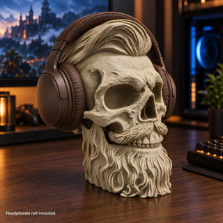 Sandstorm skull headphone stand holding brown over-ear headphones on a warm wooden desk