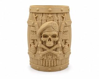 Military skull pen stand in desert sand, beret and crossed rifles sculpted on barrel front