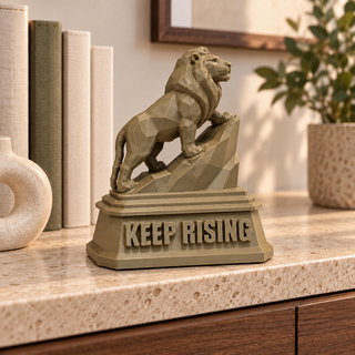 Large The Lion sculpture beside books and a planter
