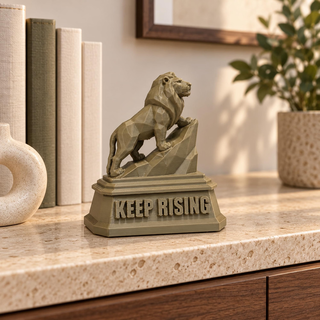 Regular The Lion sculpture displayed beside books and a planter
