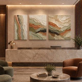 Textured relief canvas triptych in a marble reception lobby