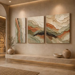 Gallery wrap relief canvas triptych above a stone ledge