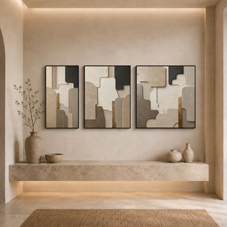 Black box framed stone relief canvas set above a stone ledge