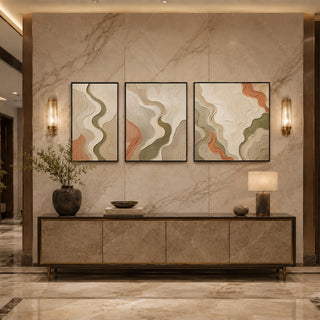 Black box framed flowing relief triptych above a marble console