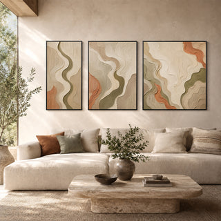 Framed 3D relief flowing wall art in a sunlit living room