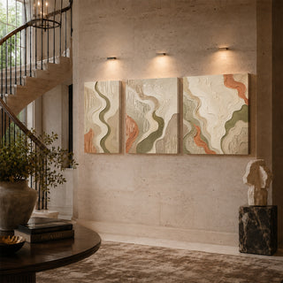 Flowing relief canvas triptych on a stairwell wall