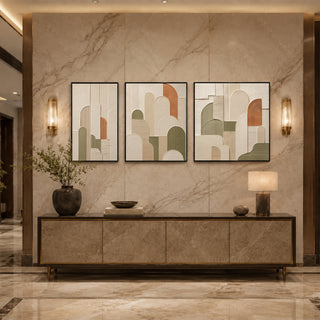 Black box framed abstract arch relief triptych above a marble console