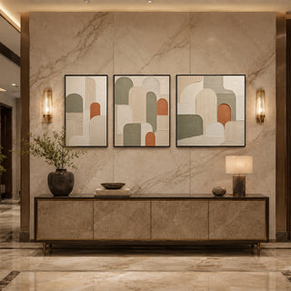 Black box framed abstract arch relief triptych above a marble console