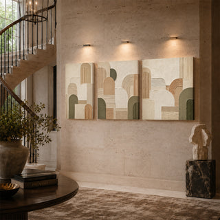 Geometric abstract relief canvas triptych on a stairwell wall