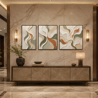 Black box framed organic abstract relief triptych above a marble console