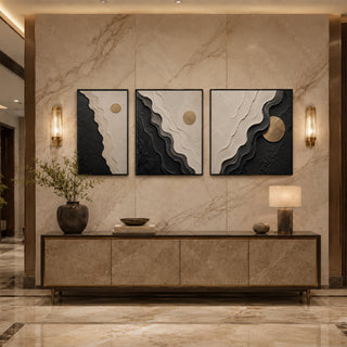 Black box framed monochrome abstract relief triptych above a marble console