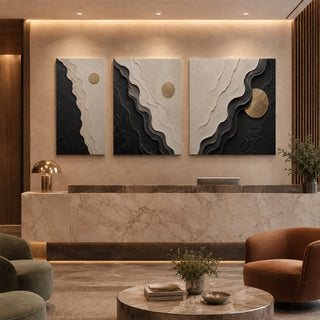 Black and white abstract relief canvas set of 3 in a marble reception lobby