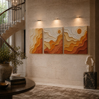Amber abstract relief canvas triptych on a stairwell wall