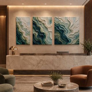 Teal abstract relief canvas set of 3 in a marble reception lobby