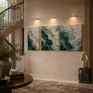 Teal abstract relief canvas triptych on a stairwell wall
