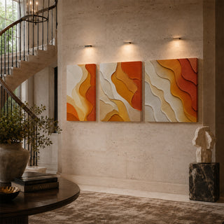 Saffron abstract relief canvas triptych on a stairwell wall