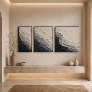 Black box framed abstract relief canvas set above a stone ledge
