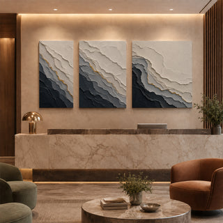 Grey abstract relief canvas set of 3 in a marble reception lobby