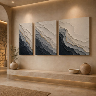 Gallery wrap grey abstract relief canvas above a stone ledge