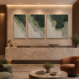Forest green abstract relief canvas set of 3 in a marble reception lobby
