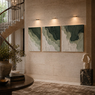 Forest green abstract relief canvas triptych on a stairwell wall