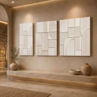 Gallery wrap ivory abstract relief canvas above a stone ledge