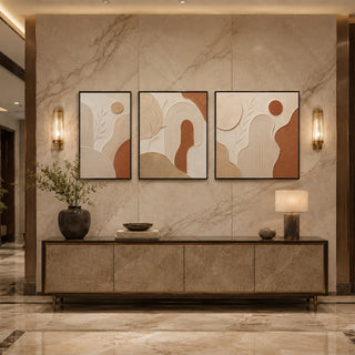 Black box framed terracotta abstract relief triptych above a marble console
