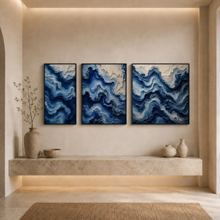 Black box framed abstract relief canvas set above a stone ledge
